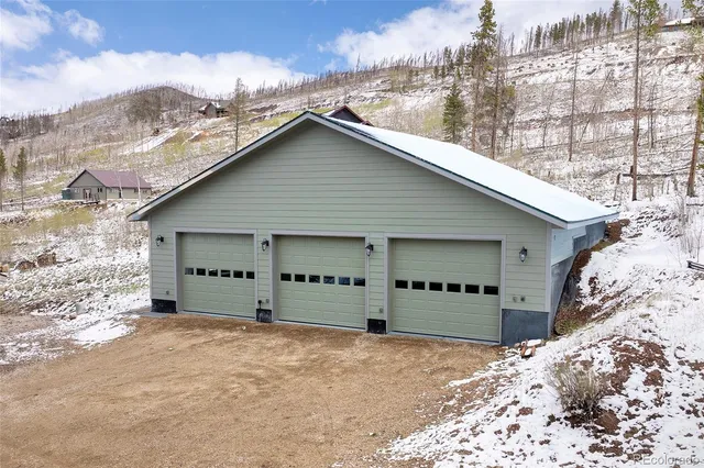 a view of a house with a snow in the yard