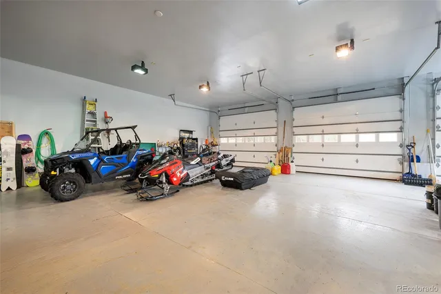 a view of a garage with parked cars