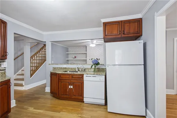 a kitchen with a refrigerator and a stove