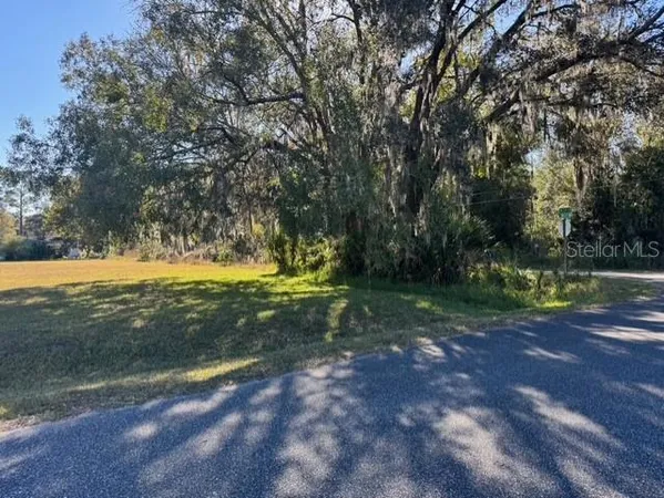 a view of a golf course with a yard