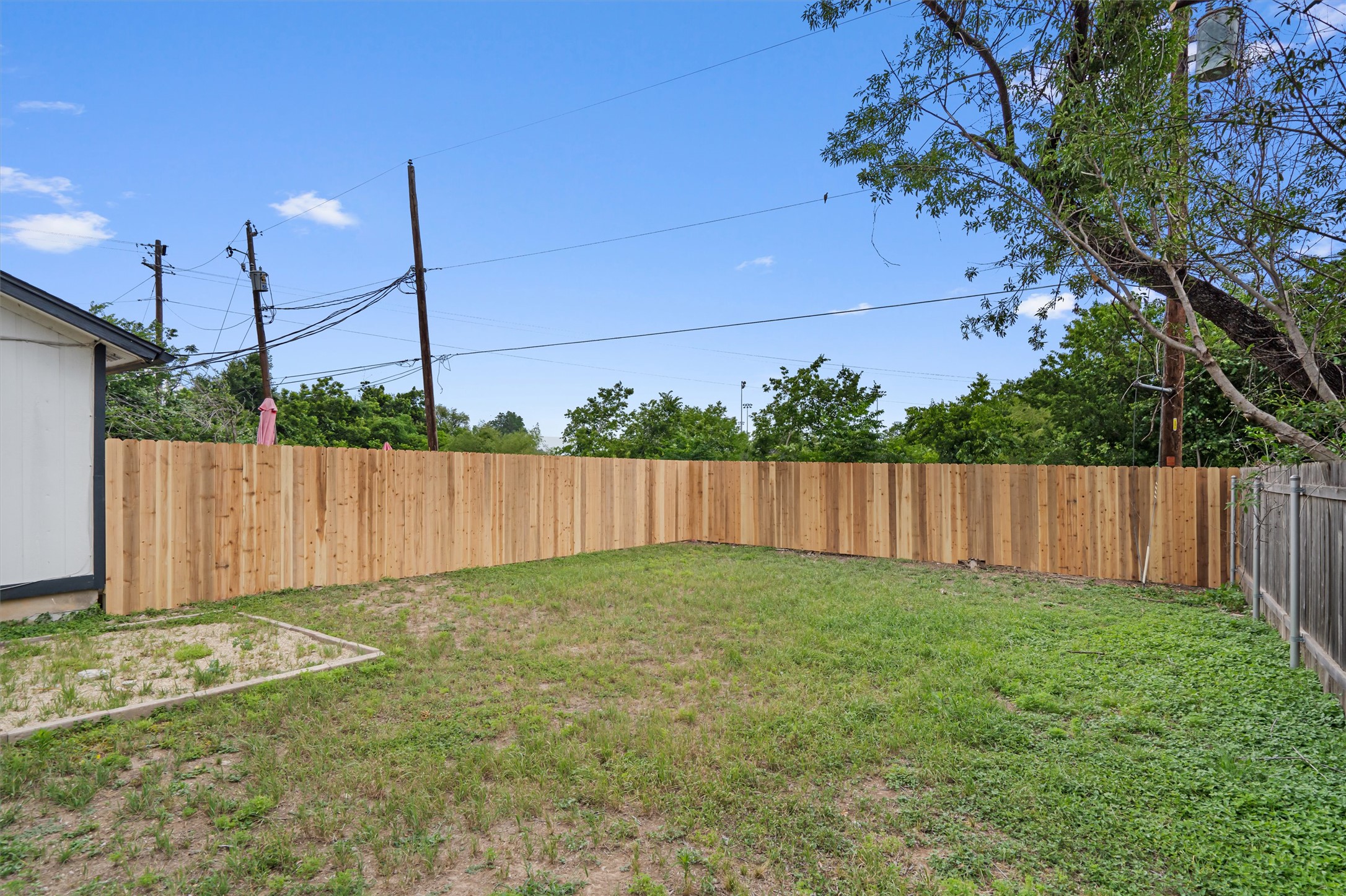 13357 Water Oak Lane, Unit A Austin, TX 78729 - Photo 23 of 26 a view of backyard with potted plants