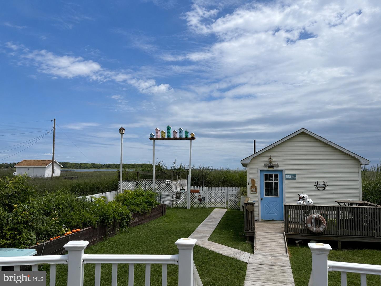 16261 Main Ridge Road Tangier, VA 23440 - Photo 6 of 38 Charming coastal retreat with vibrant skies.