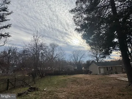 a view of a backyard of the house