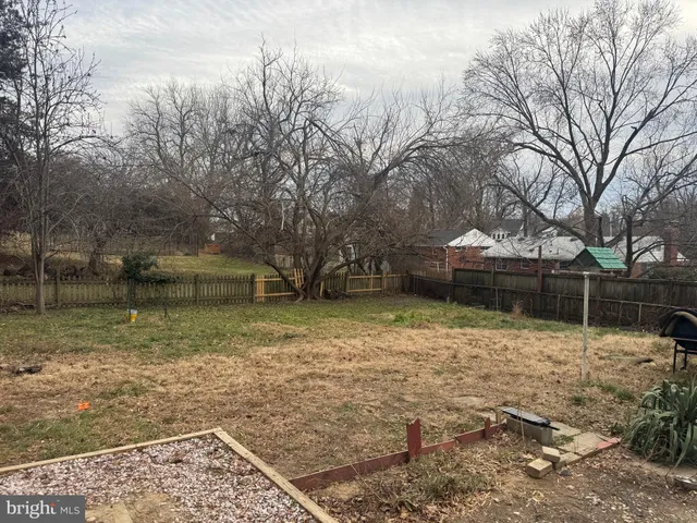a view of a backyard of the house