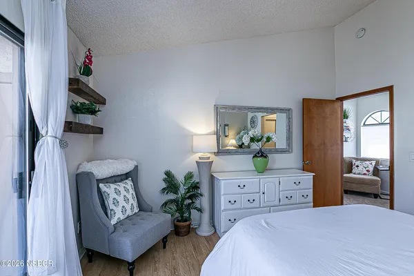 a bedroom with a bed and furniture