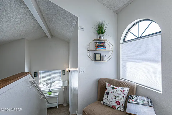 a living room with furniture and a window