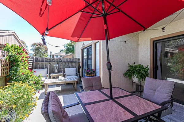 a view of a backyard with sitting area