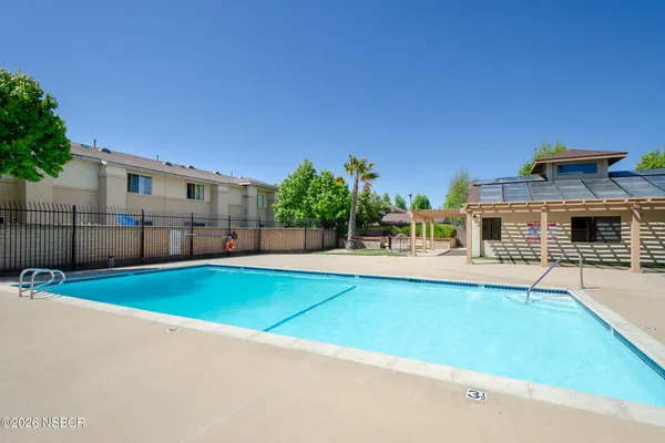 a view of a house with swimming pool