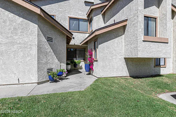 a view of front door and yard