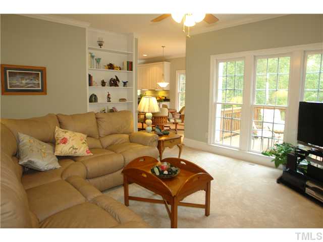 4612 Groundnut Court Raleigh, NC 27613 - Photo 3 of 12 a living room with furniture and a flat screen tv