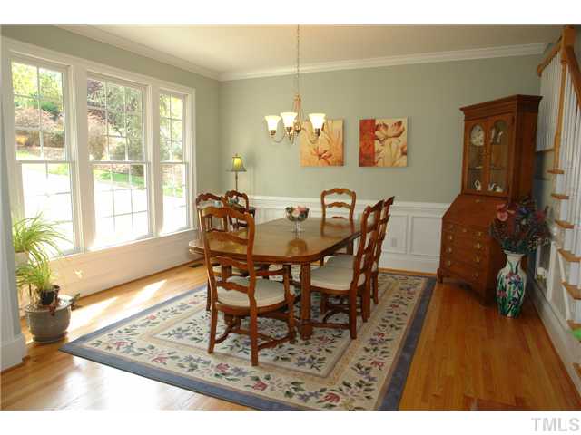 4612 Groundnut Court Raleigh, NC 27613 - Photo 5 of 12 a dining room with furniture and wooden floor