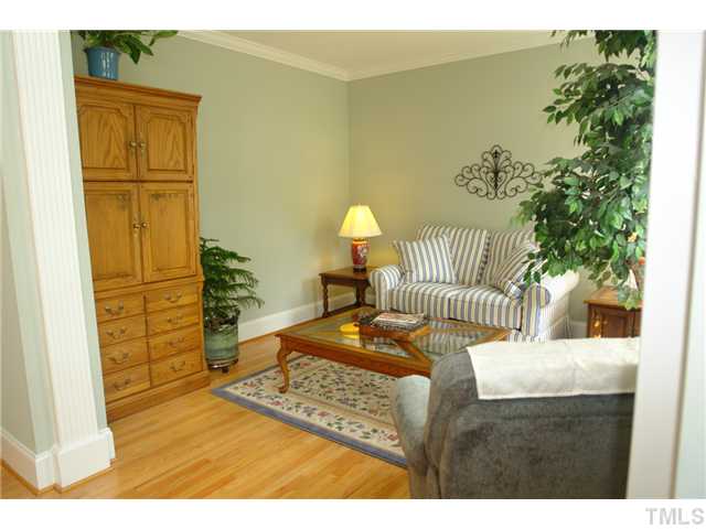 4612 Groundnut Court Raleigh, NC 27613 - Photo 6 of 12 a bedroom with a bed and a view of balcony