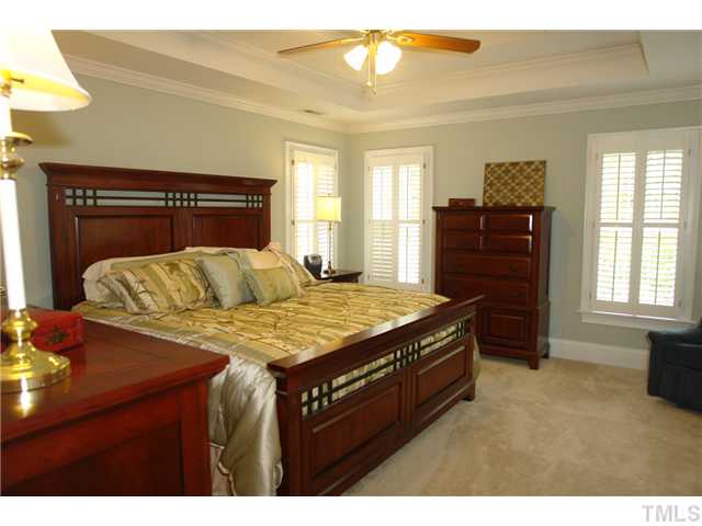 4612 Groundnut Court Raleigh, NC 27613 - Photo 7 of 12 a living room with a bed and furniture