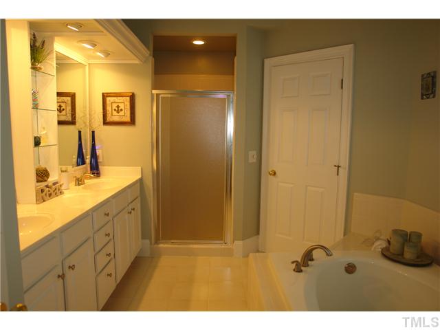 4612 Groundnut Court Raleigh, NC 27613 - Photo 8 of 12 a bathroom with a sink and mirror