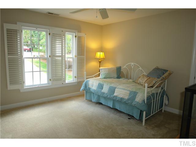4612 Groundnut Court Raleigh, NC 27613 - Photo 9 of 12 a bedroom with a bed and window