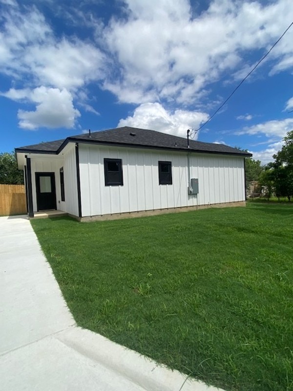 116 Field Street Luling, TX 78648 - Photo 18 of 33 A newly constructed residence showcasing crisp white siding and a well-kept lawn, ready for personalization.