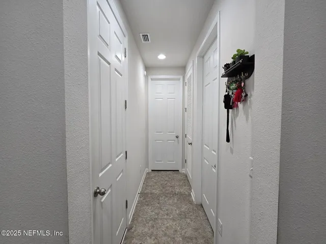 a bathroom with a toilet a sink and a mirror