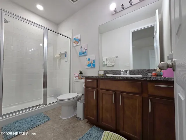 a kitchen with stainless steel appliances granite countertop a sink stove and microwave