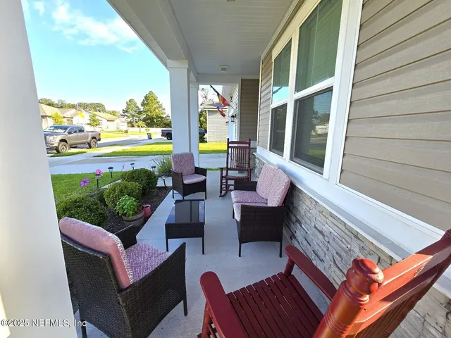 a view of an outdoor sitting area with furniture