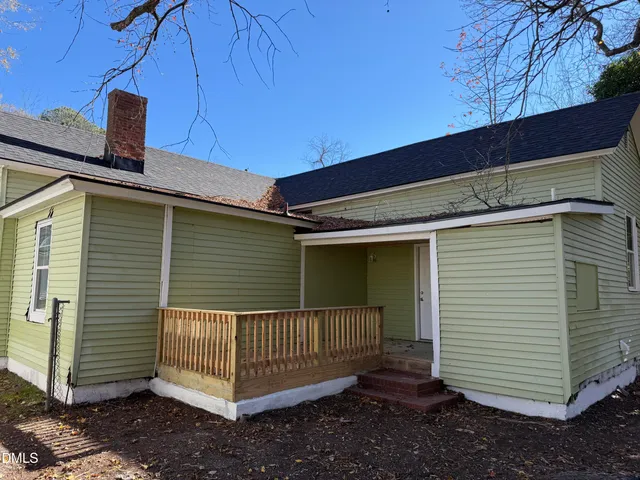 a view of a backyard with a swing