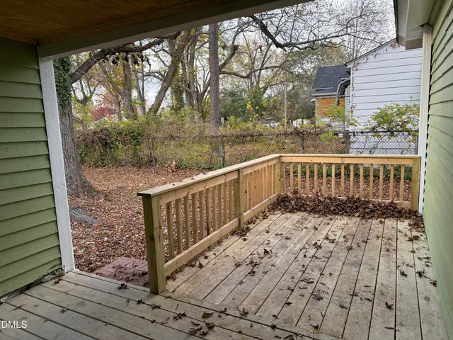 a view of a balcony with wooden floor