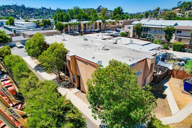 an aerial view of a house with yard swimming pool and outdoor seating