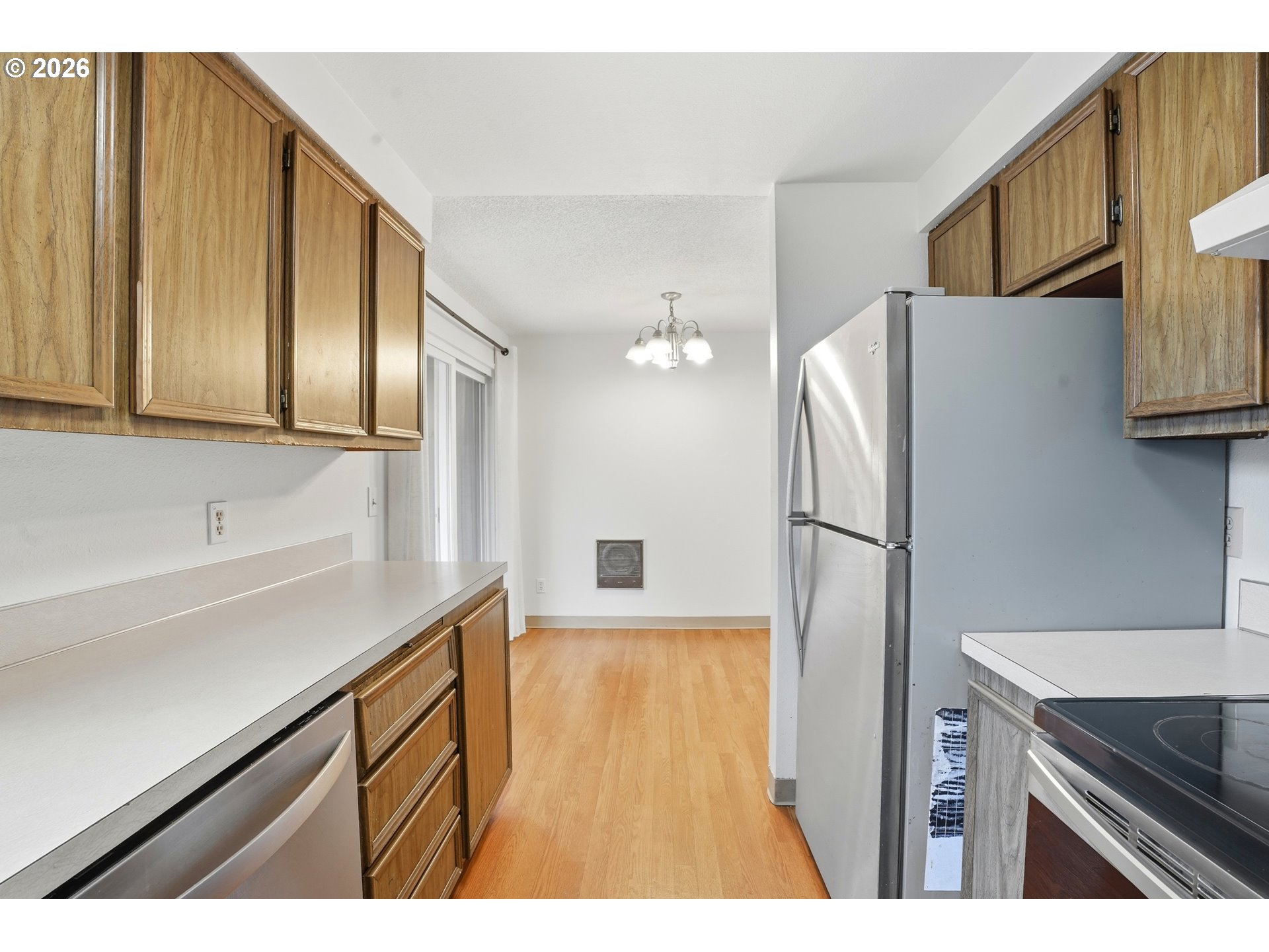 3537 Southeast 64th Avenue Portland, OR 97206 - Photo 13 of 32 a kitchen with a refrigerator and a sink