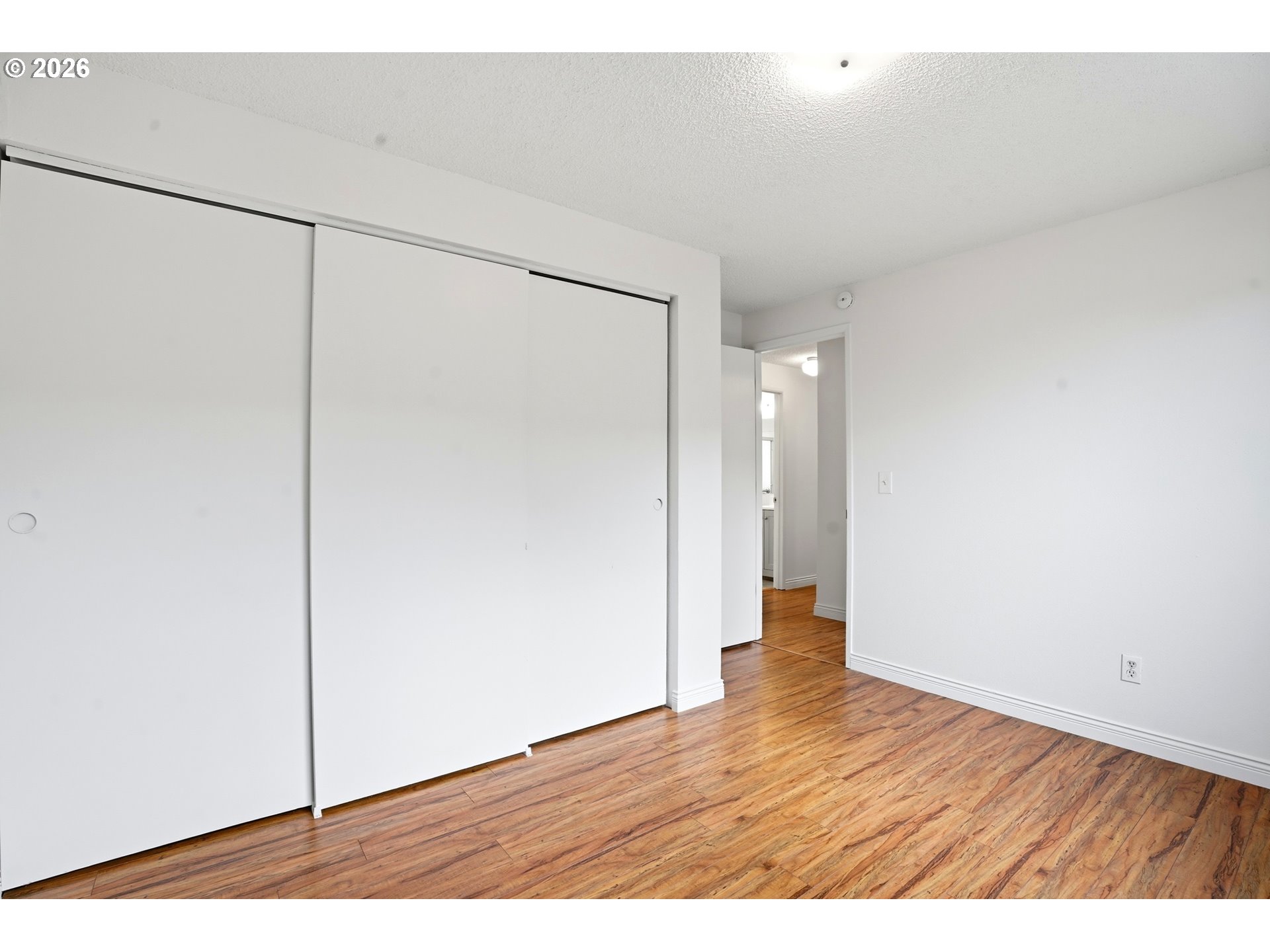 3537 Southeast 64th Avenue Portland, OR 97206 - Photo 18 of 32 a view of an empty room with wooden floor