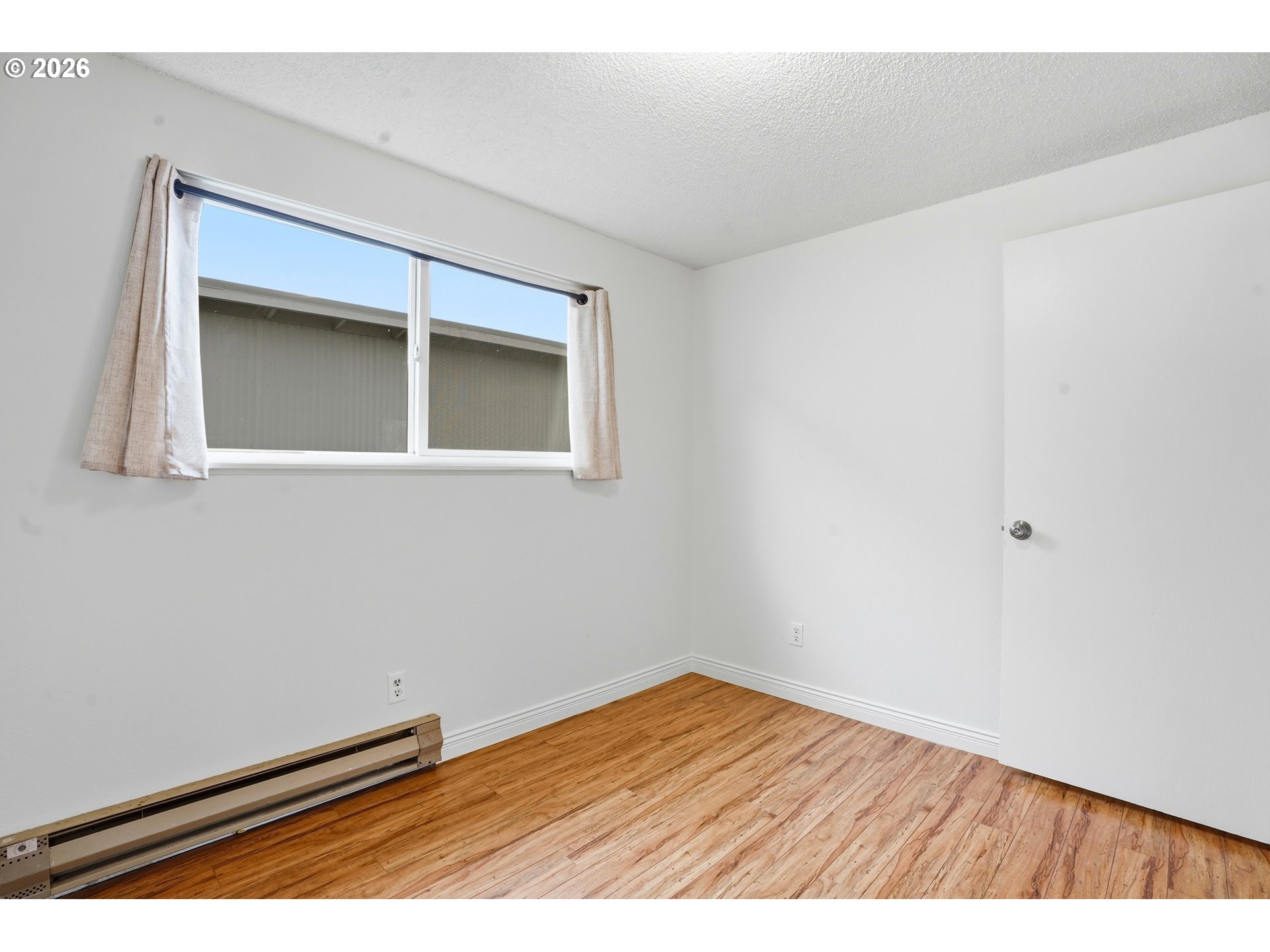3537 Southeast 64th Avenue Portland, OR 97206 - Photo 22 of 32 a view of wooden floor in a room