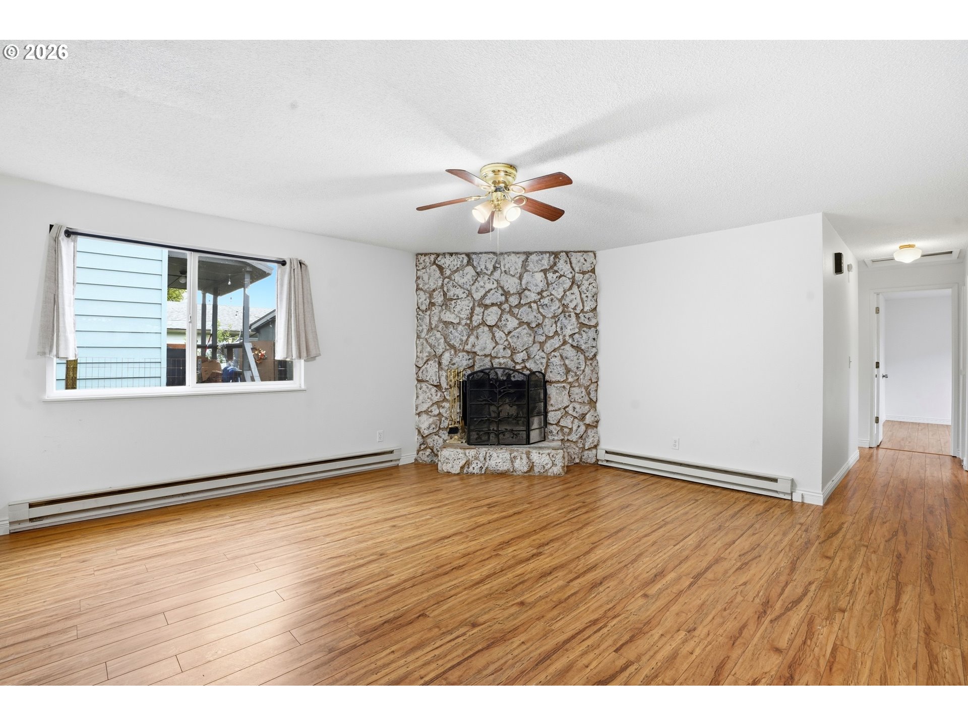3537 Southeast 64th Avenue Portland, OR 97206 - Photo 5 of 32 wooden floor in an empty room with a window