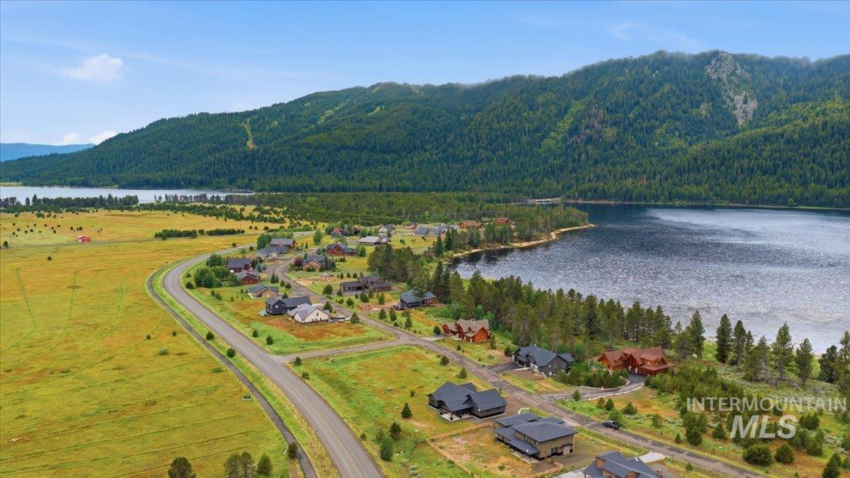 13152 Hawks Bay Road Donnelly, ID 83615 - Photo 29 of 29 Lakeside community featuring a paved road, scattered residences, and surrounding natural landscapes