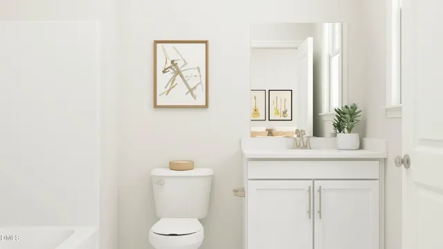 a bathroom with a sink mirror and toilet