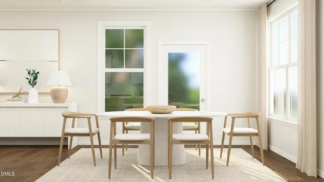 a view of a dining room with furniture and a window