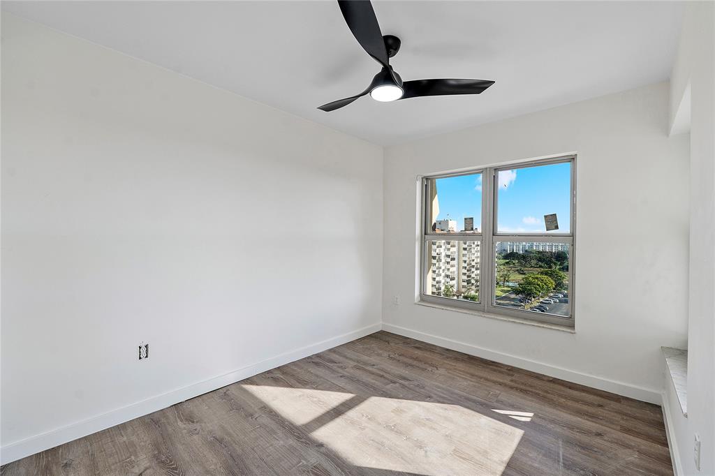 4174 Inverrary Drive, Unit 1002 Lauderhill, FL 33319 - Photo 11 of 28 an empty room with windows