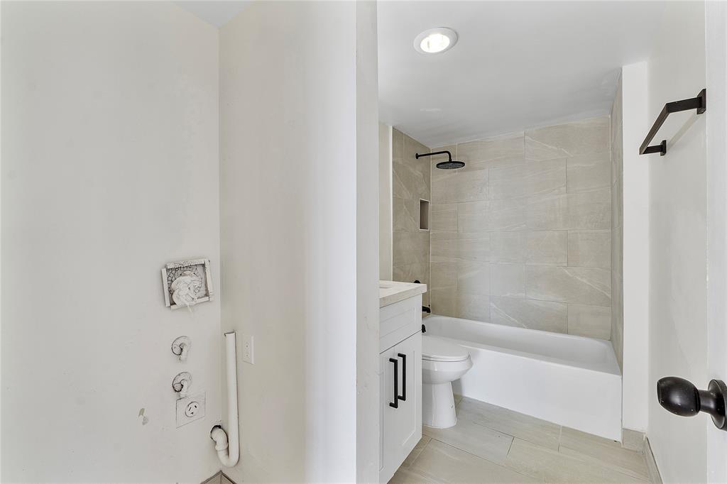 4174 Inverrary Drive, Unit 1002 Lauderhill, FL 33319 - Photo 19 of 28 a bathroom with a bathtub and shower