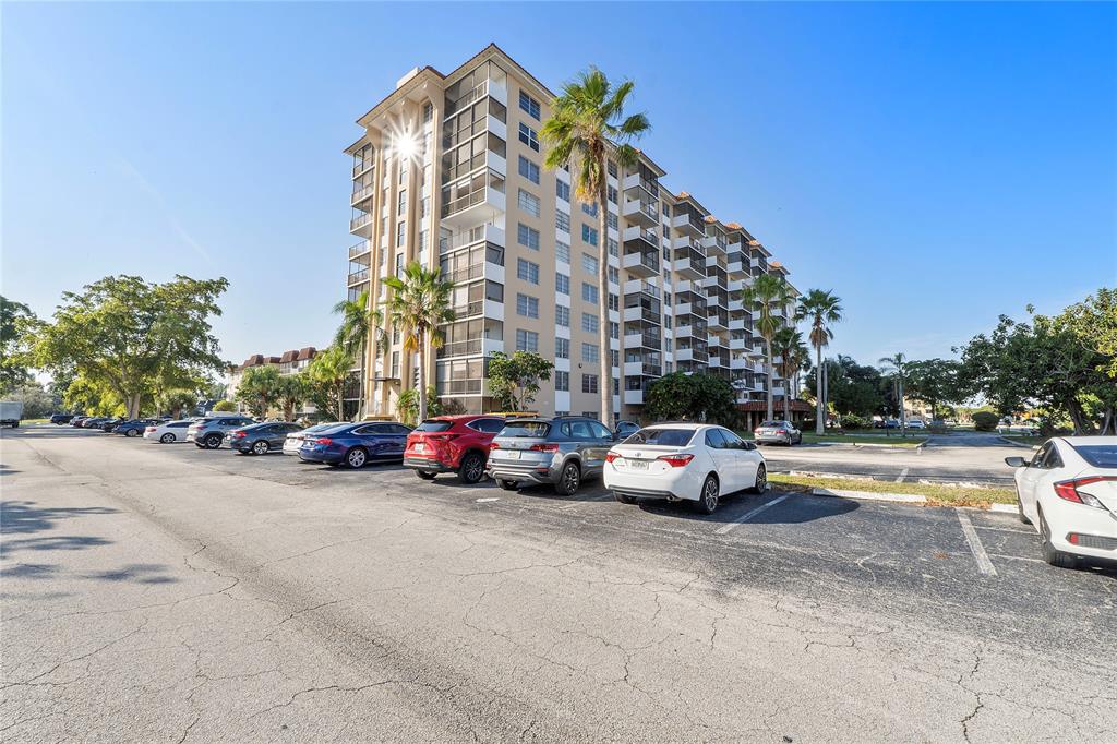 4174 Inverrary Drive, Unit 1002 Lauderhill, FL 33319 - Photo 3 of 28 a view of street with parked cars