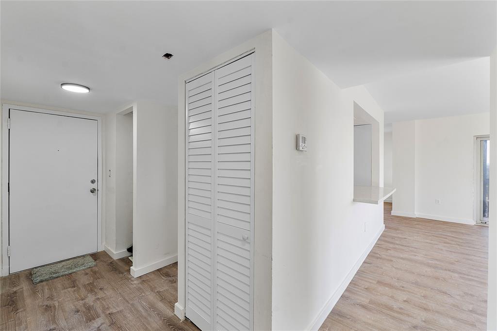 4174 Inverrary Drive, Unit 1002 Lauderhill, FL 33319 - Photo 4 of 28 a view of a hallway with wooden floor and closet