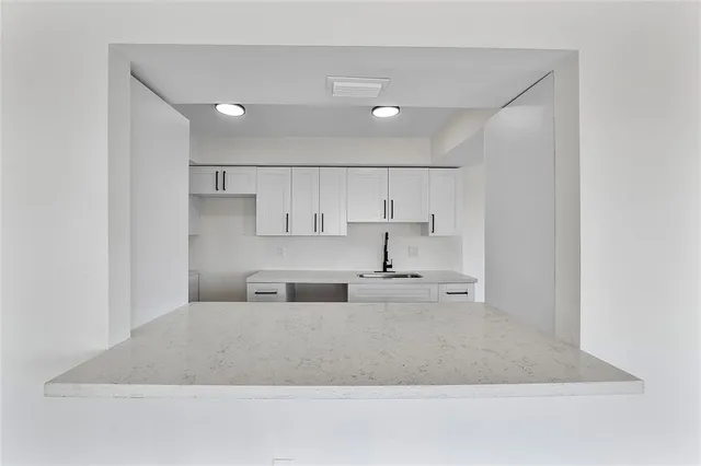 a bathroom with a toilet sink and a mirror