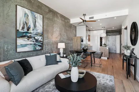 a living room with furniture and wooden floor