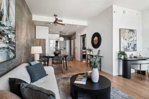 a living room with fireplace furniture and wooden floor