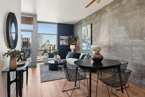 a dining room with furniture and wooden floor