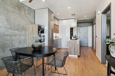 a view of a dining room with furniture and wooden floor