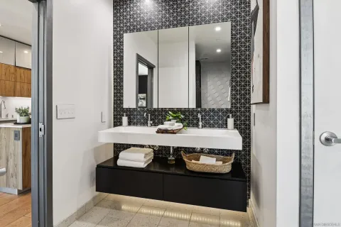 a en suite bathroom with a sink and mirror