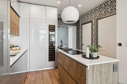 a kitchen with stainless steel appliances a sink and a refrigerator
