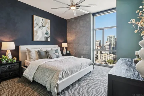 a bedroom with bed and window