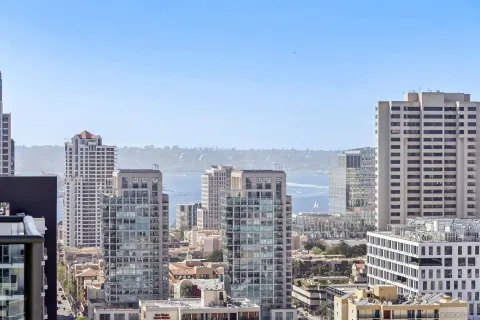 a view of city with tall buildings