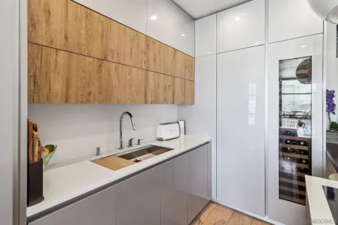 a room with a sink and cabinets