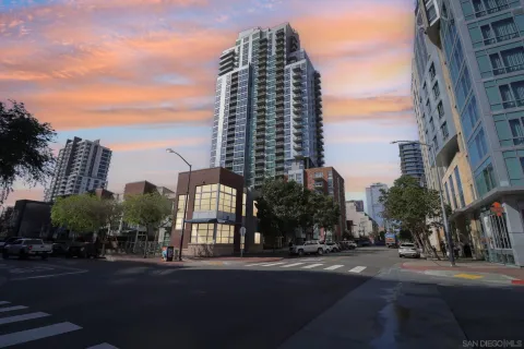 a view of a city street lined with tall buildings