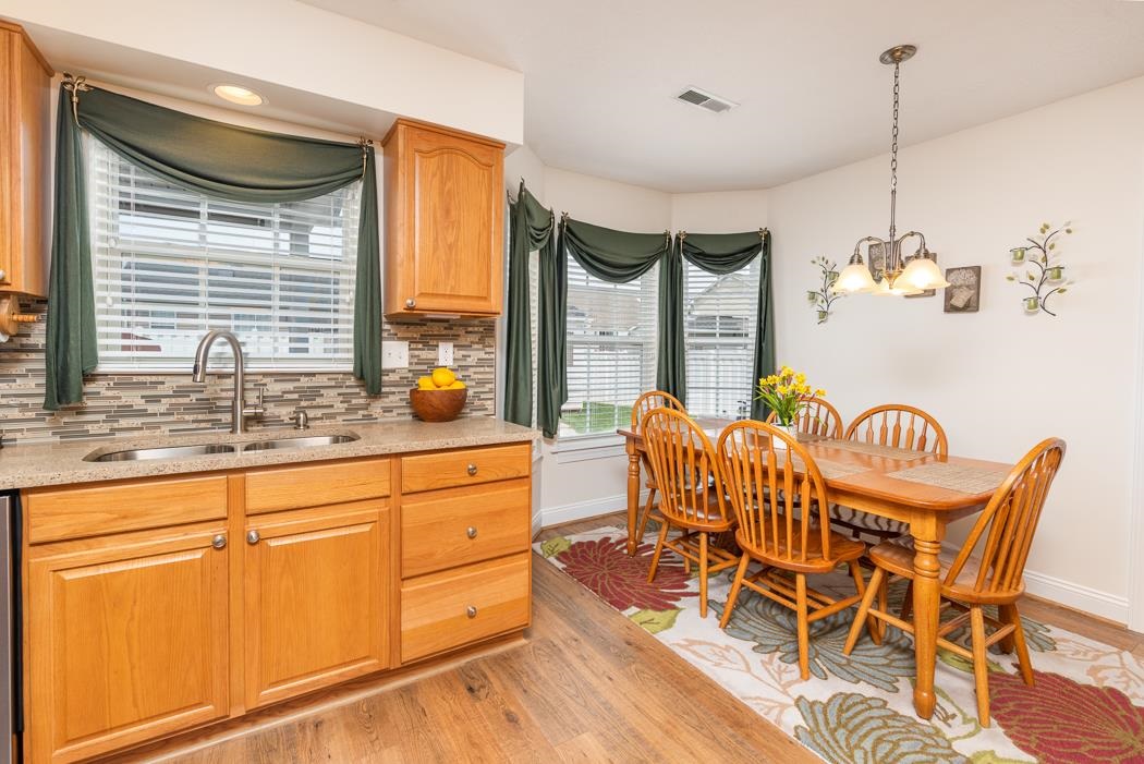 213 Inglecress Road Waynesboro, VA 22980 - Photo 18 of 68 a dining room with furniture a chandelier and wooden floor