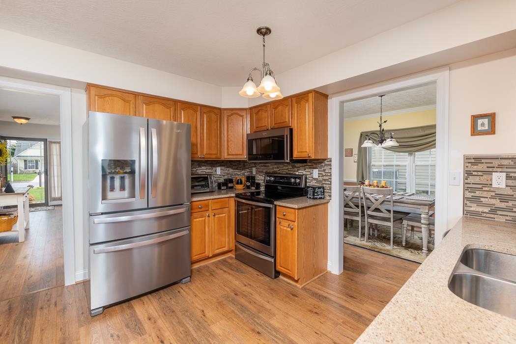 213 Inglecress Road Waynesboro, VA 22980 - Photo 20 of 68 a kitchen with granite countertop a refrigerator oven stove top oven and sink
